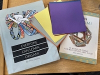 Origami kit with paper and two books to teach origami basics